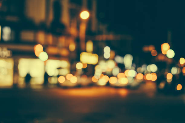 Defocused urban abstract texture bokeh city lights & traffic jams in the background with blurring lights.