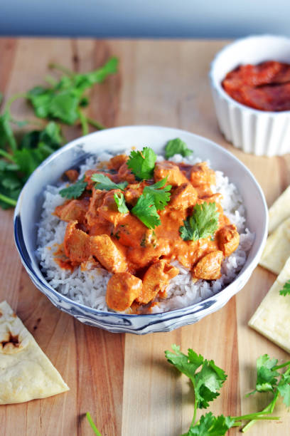 istock Indian Butter Chicken with Mango Chutney and Naan 895584942
