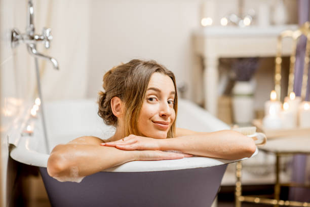 istock Woman bathing at the retro bathroom 895603210