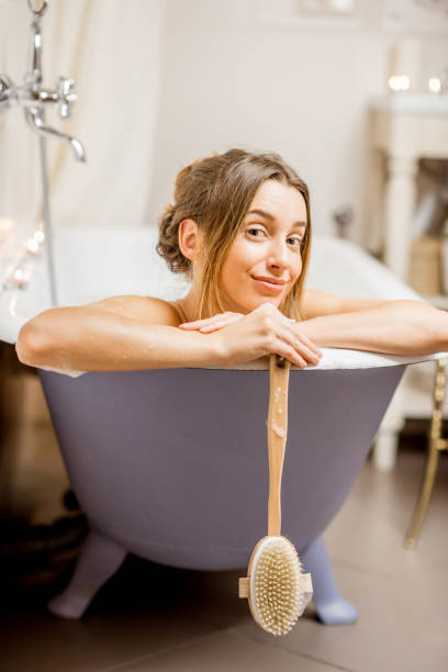 istock Woman bathing at the retro bathroom 895603358