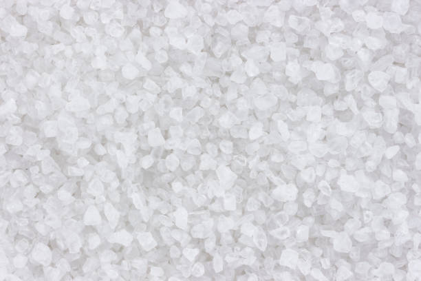 istock Coarse sea salt background closeup top view 895606090