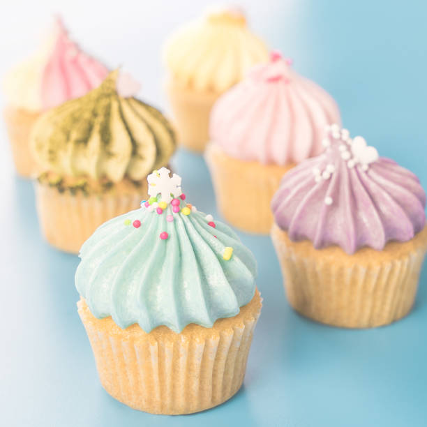 istock mini fancy cupcakes muffins on bright blue background 895606462