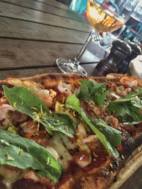 istock pizza and a glass of wine on table 895610194