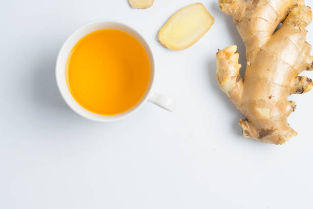 istock hot ginger tea ginger ale ginger beer in glass with ginger slice on white background 895613386