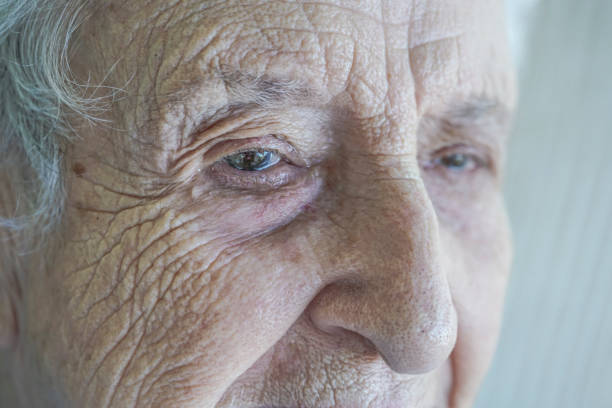 istock closeup face of a senior person crying 895617110