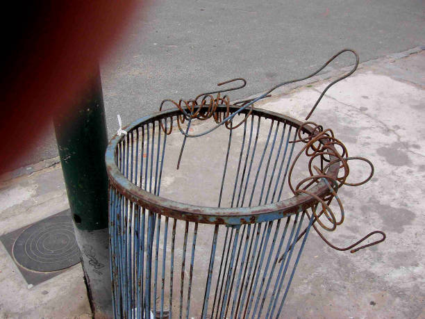BENT WIRE TRASH CAN stock photo