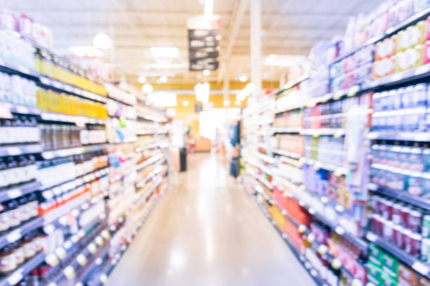 istock Blurred soda, bottled tea, juices in retail store 895623028