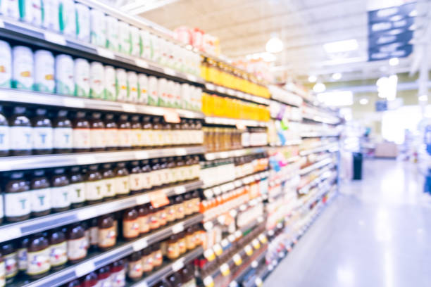 istock Blurred soda, bottled tea, juices in retail store 895623204