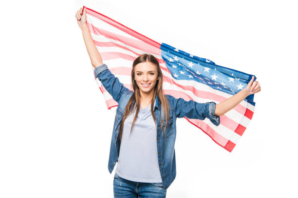 istock young woman with us flag 895623316