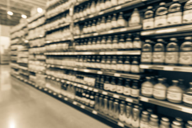 istock Blurred soda, bottled tea, juices in retail store 895625938