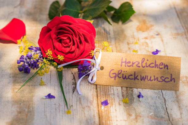 istock Bunch of flowers with congratulation card 895629392