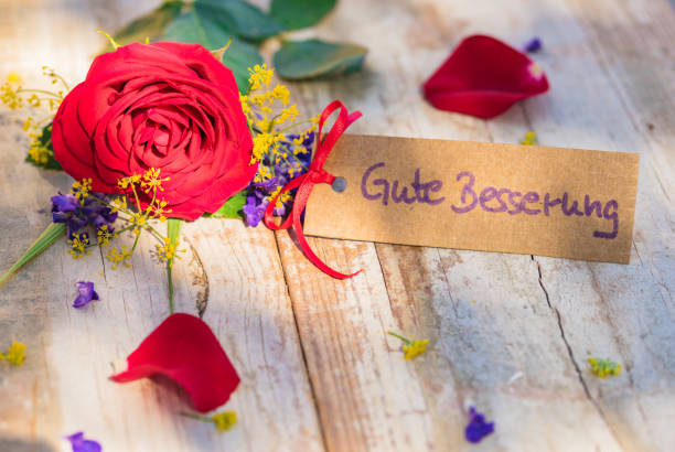 istock Get well soon card with flowers 895640900