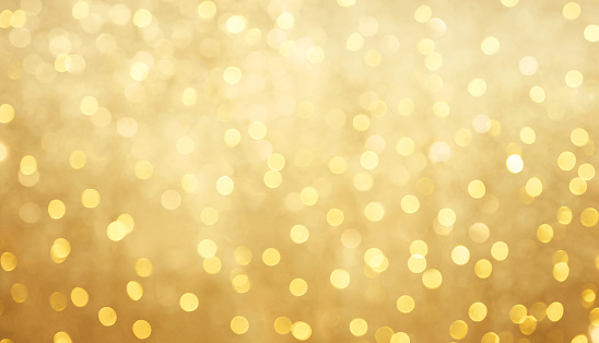 Golden Holiday bokeh background with copy space. Texture for design invite for happy New year