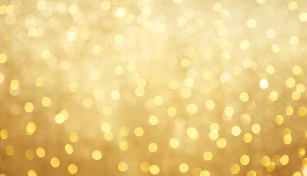 Beautiful blurred golden bokeh background Golden Holiday bokeh background with copy space. Texture for design invite for happy New year"u2019s or Christmas, Birthday, Anniversary, Wedding. Decorative Wallpaper with Golden Glitter light confetti 50th anniversary photos stock pictures, royalty-free photos & images