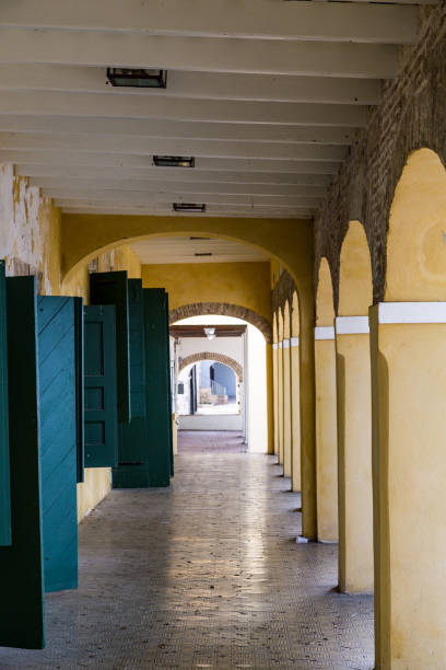 istock Yellow Columns and Blue Doors 895643258