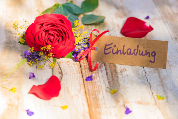 istock Red rose flower with invitation card 895645912