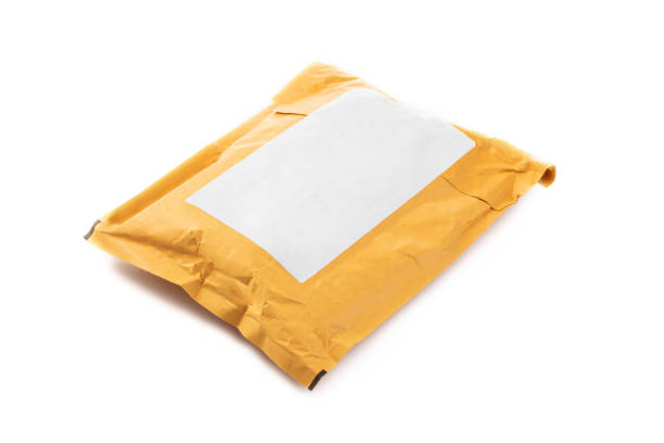 istock Small paper post packet isolated on the white background 895651270