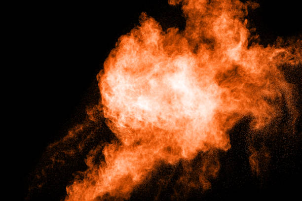 istock Abstract orange dust explosion on  black background. abstract orange powder splattered on black background, Freeze motion of orange powder splash. 895653800