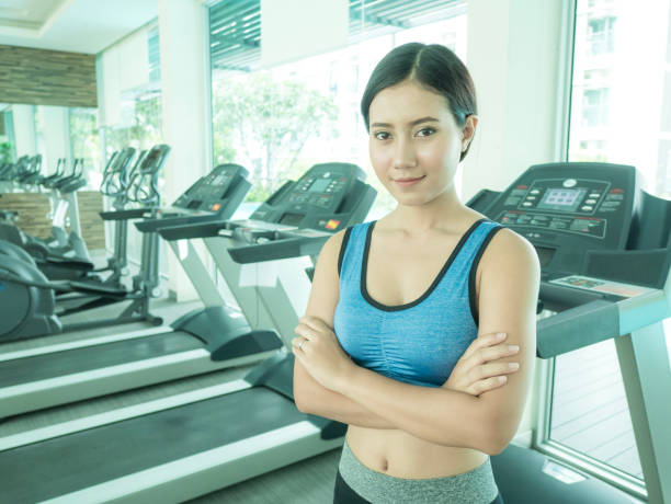 istock Asian Woman do exercise alone with attractive Smiling. Woman with Exercise Concept 895657292