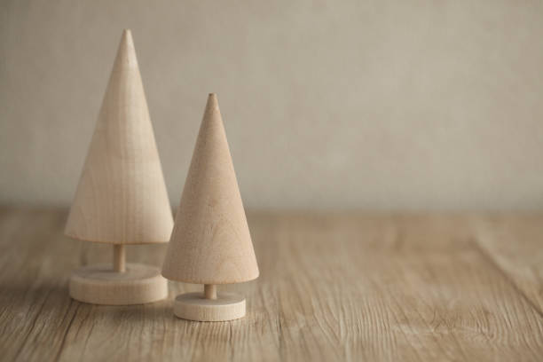 istock wood trees miniature isolated on table 895657428