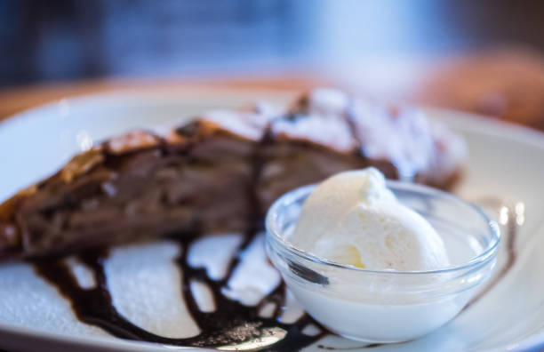 istock Apple strudel with vanilla ice cream partially blurred during shooting 895657764
