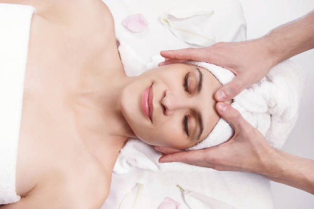 istock Spa massage of the face and neck 895661020