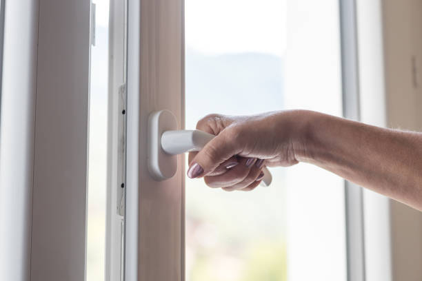 istock Female hand opening a window 895672166
