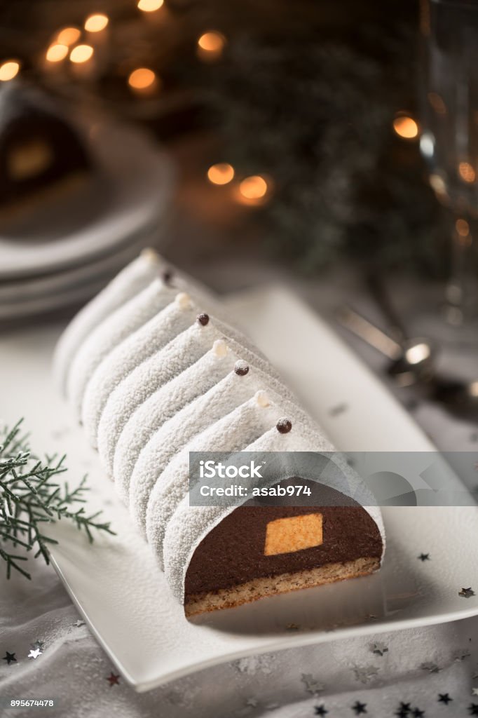 Delicious traditional French Christmas cake Delicious traditional French Christmas cake called Bûche de Noël Christmas Stock Photo