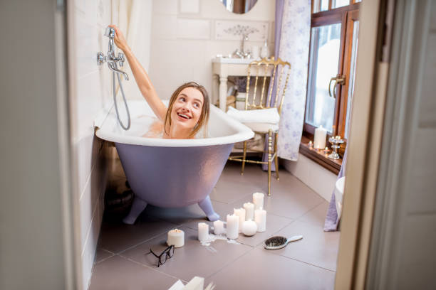 istock Woman bathing at the retro bathroom 895675254