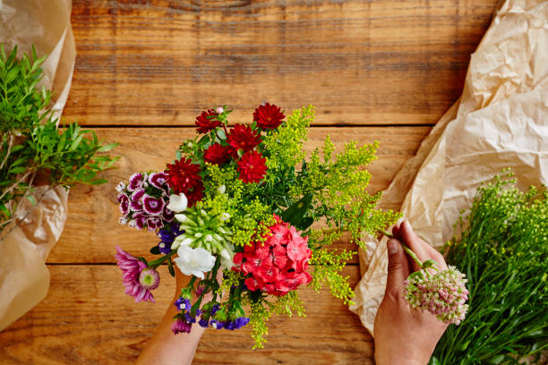 istock creating a wild flowers bouquet flowershop with hands 895677564