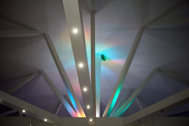 istock Abstraction.Beams under Polycom with coloured lights. Beautiful rich colors 895677566