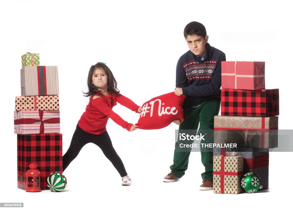Who is nicer this year I'm nicer no, is me! Boys Stock Photo