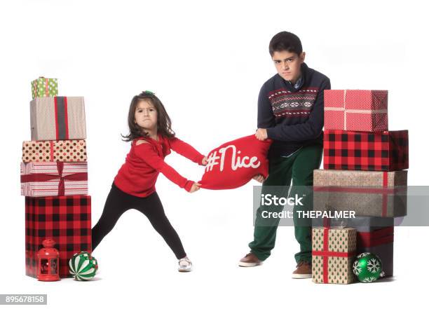 Who Is Nicer This Year Stock Photo - Download Image Now - Boys, Celebration, Cheerful