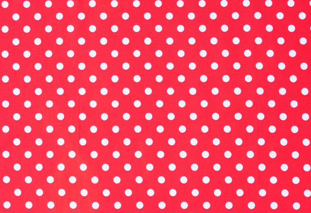 istock Red fabric background texture with white polka dots 895678592