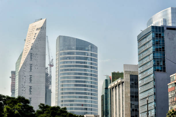 This photograph has been taken on November 28, 2017 in Mexico City. It shows one of the great buildings of the promenade. La Reforma Avenue is one of the most beautiful avenues in Mexico City and one of the most famous avenues in the world. It has a great cultural content for the amount of monuments that are along its 12 kms in length; important world-class hotels and financial offices in Latin America. It is currently in constant change. It is common to see in this avenue demonstrations and marches that take it as a way to reach the Zócalo, which is why it is sometimes closed to traffic.