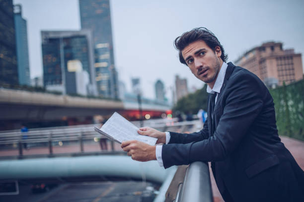 istock Businessman with newspaper 895696828