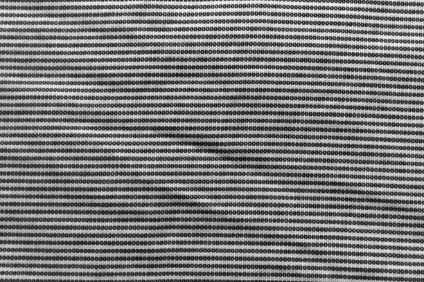 istock Black and white closeup of stripped fabric texture 895699266