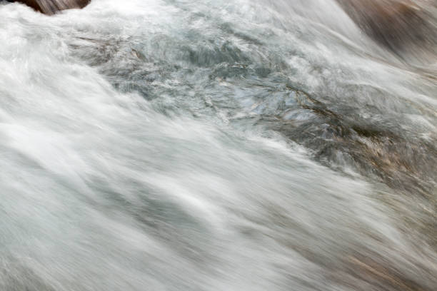 istock rough water in the mountain river water as a background 895699960