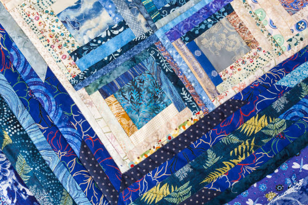 istock patchwork, homemade, hobby, comfort, interior, tradition concept - there is magic combination of floral patterns on blue colored quilt made of sewed different patches 895702370