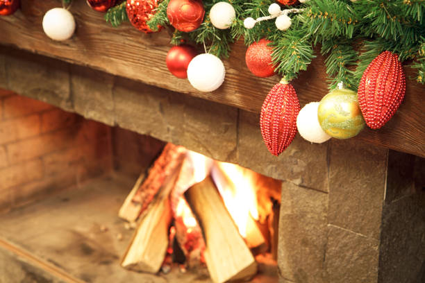 istock New Year / Christmas tree with colorful festive decorations on the fireplace 895706136