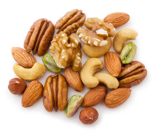 Walnuts, pecans,almonds, hazelnuts ans pistachios isolated on white background