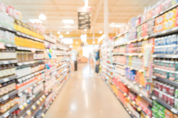 istock Blurred soda, bottled tea, juices in retail store 895715992