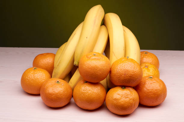 istock fresh bananas and tangerines 895743416