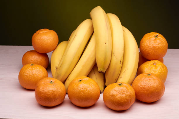 istock fresh bananas and tangerines 895743456