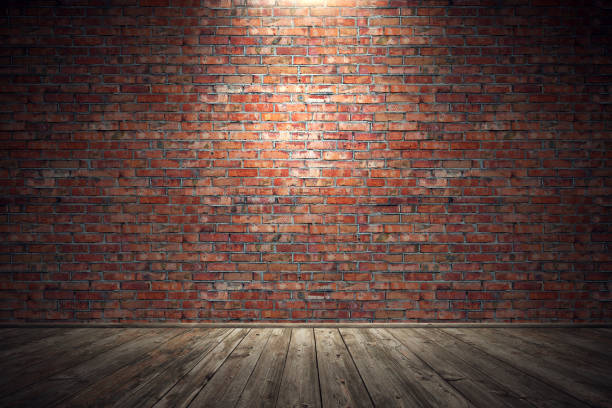 istock Empty old grungy room with red brick wall and wooden floor 895744116