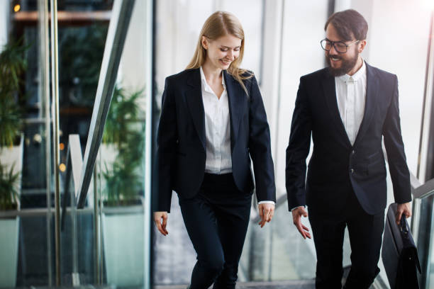 istock Business colleagues talking on stairs 895749420