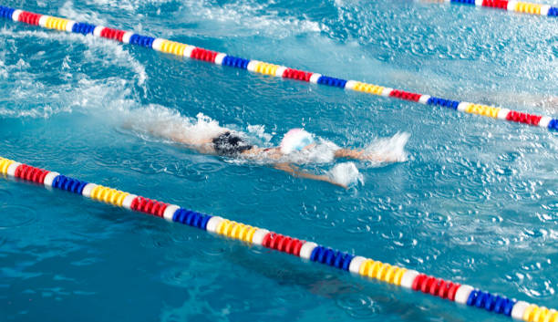 istock Girl swimming in the pool 895758356