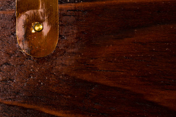 istock dark weathered teak wood with copper 895770120