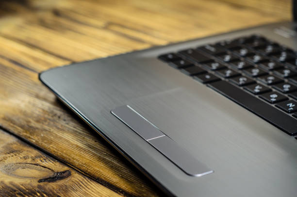 istock Laptop on wooden table 895790858