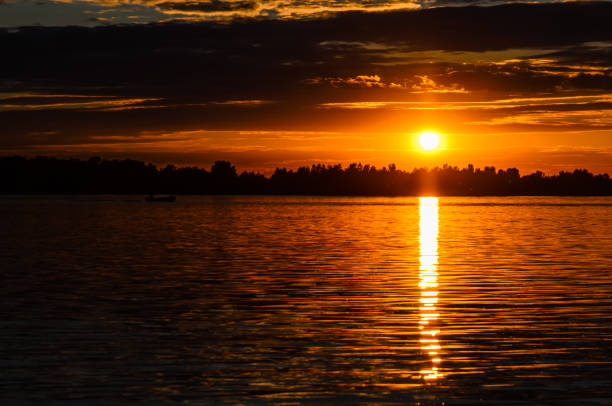 istock Silhouette of the boat on river Dnieper at sunset 895791116